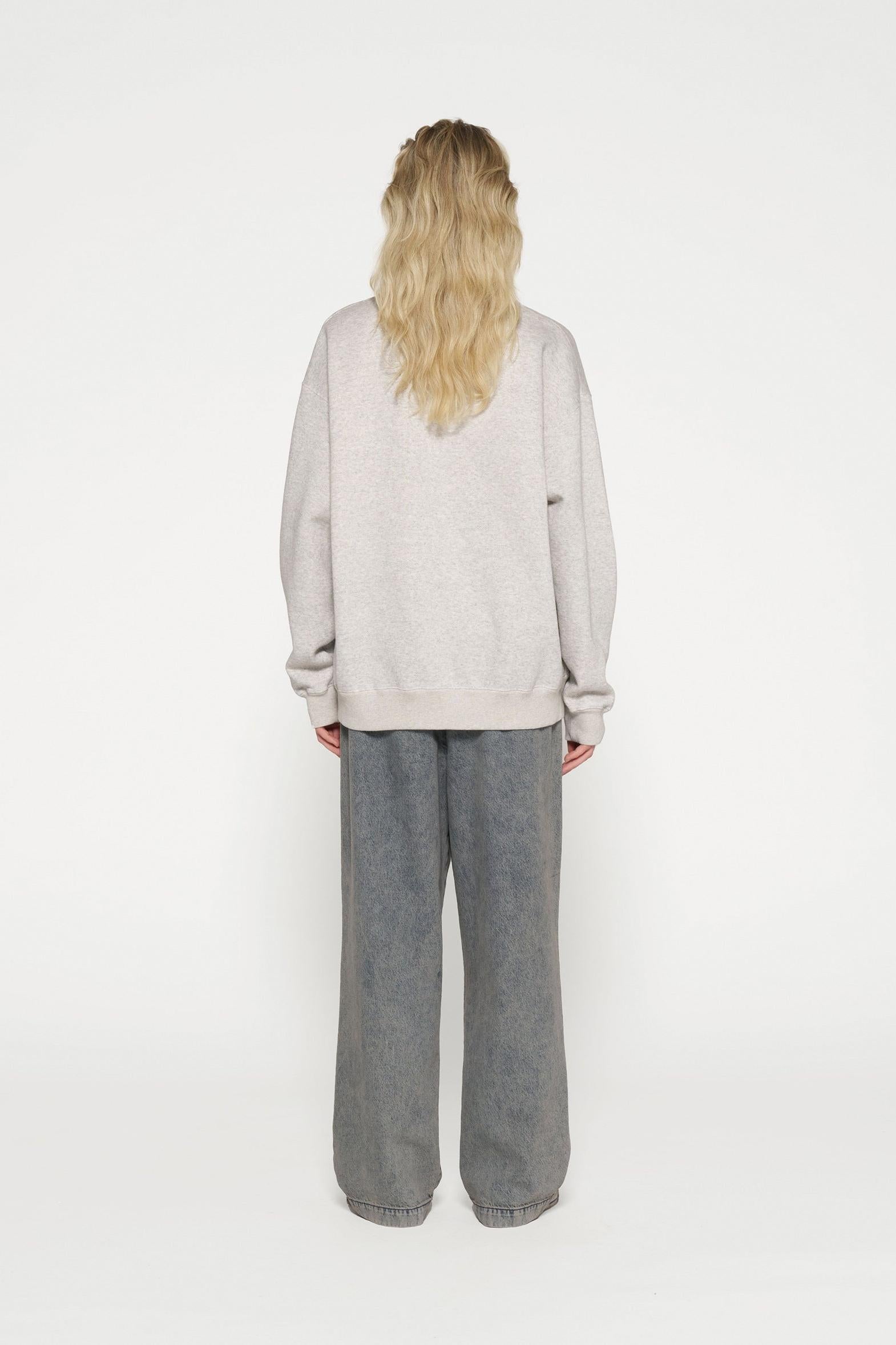 RAW EDGE STATEMENT SWEATER