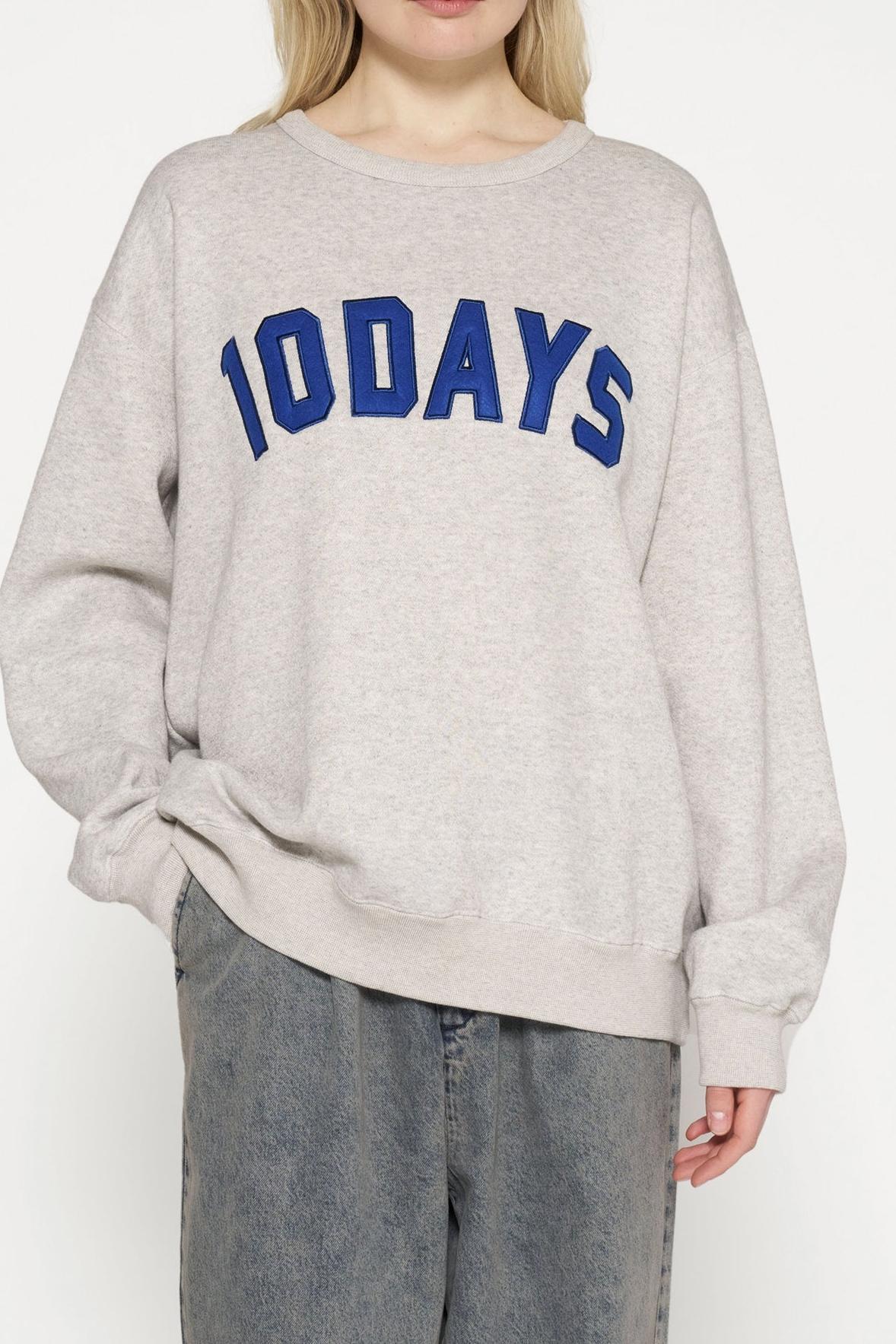 RAW EDGE STATEMENT SWEATER