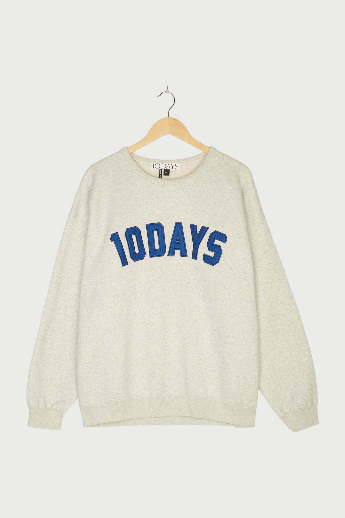 RAW EDGE STATEMENT SWEATER