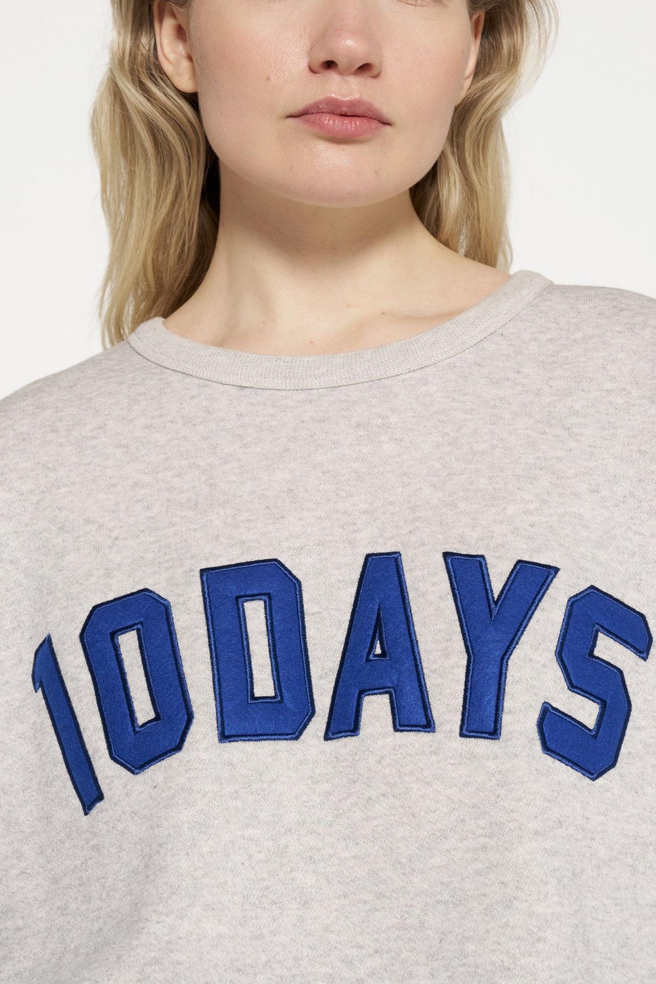 RAW EDGE STATEMENT SWEATER