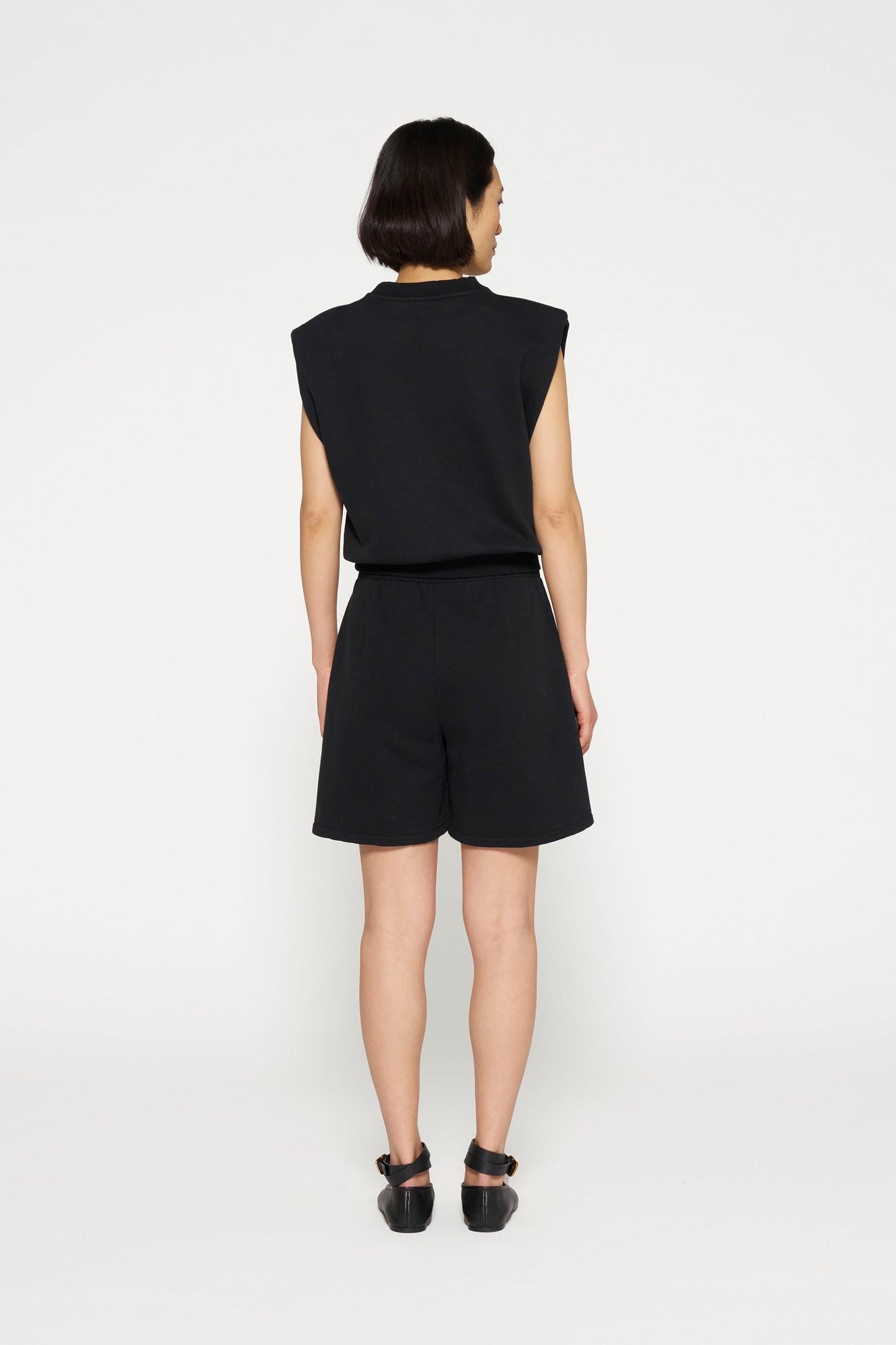 SLEEVELESS STATEMENT TOP
