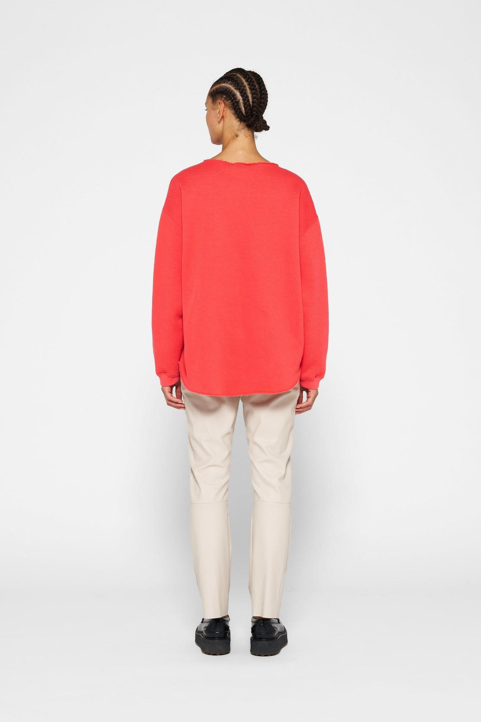 RAW EDGE STATEMENT SWEATER